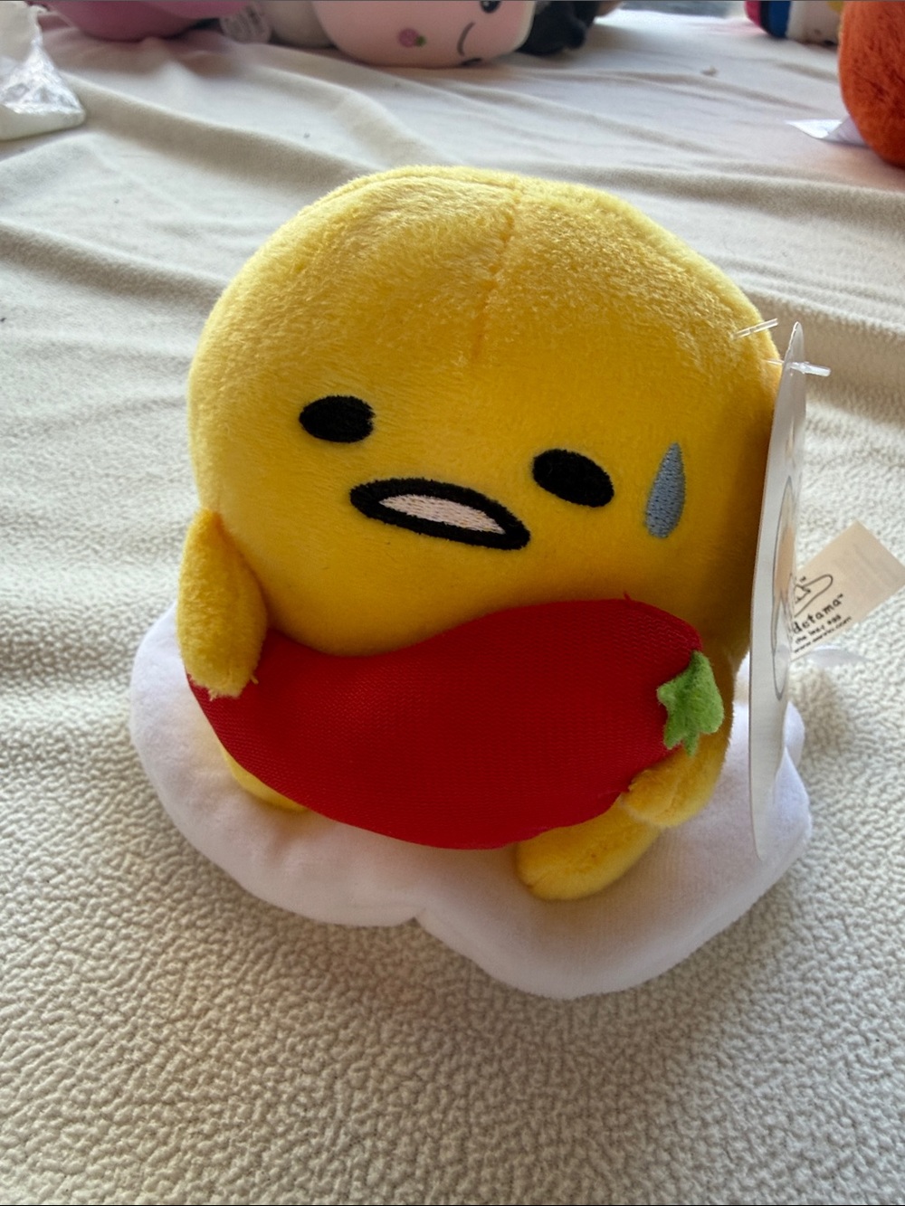 Gund Yellow Gudetama Plush Holding Red Chili